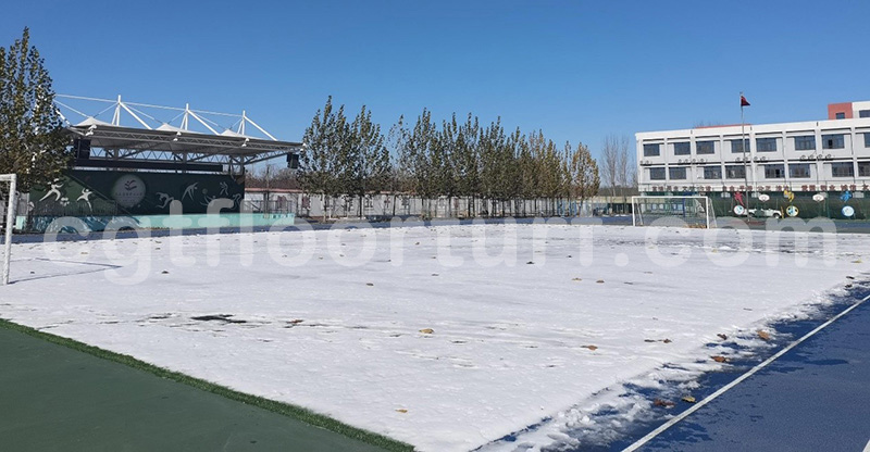 Year-round green artificial turf enables outdoor sports in all weather conditions